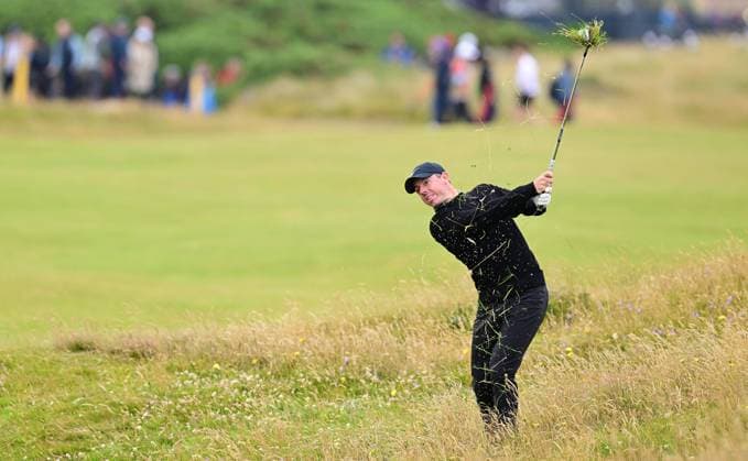 Rory McIlroy hit this shot from the deep rough into a green side bunker on the 15th fairway The British Open Championship, Day One, Golf, Royal Troon, Troon, UK - 18 July 2024  Copyright: xGreigxCowie Shutterstockx 14587994by