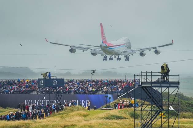A Cargolux cargo plane descends over Royal Troon as it lands at nearby Prestwick International Airport. The British Open Championship, Day One, Golf, Royal Troon, Troon, UK - 18 July 2024  Copyright: xStuartxWallace Shutterstockx 14588001bz