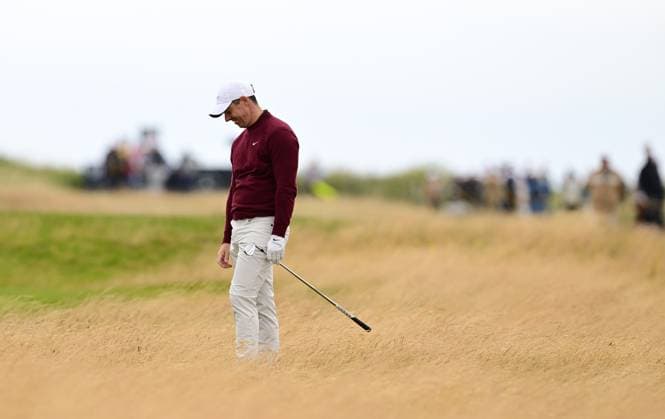 Correction Rory McIlroy looks dejected after knocking his second shot on the 3rd fairway into the rough behind the green The British Open Championship, Day Two, Golf, Royal Troon, Troon, UK - 19 July 2024  Copyright: xGreigxCowie Shutterstockx 14587995bn