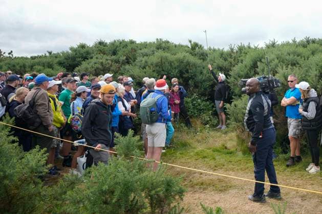 19th July 2024; Royal Troon Golf Club, Troon, South Ayrshire, Scotland; The Open Championship Round 2; A Marshall holds up a road pin to give line of site ruling in the 11th holes after Shane Lowry hits a wayward second shot  ActionPlus12669961 StevenxFlynn