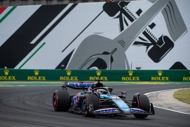Esteban Ocon BWT Alpine F1 Team, France, 31 in Alpine A524 in front of a painting of a silver Formula 1 car and Rolex branding, HUN, Formula 1 World Championship, Hungarian Grand Prix, Hungaroring, Free Practice, 20 07 2024 HUN, Formula 1 World Championship, Hungarian Grand Prix, Hungaroring, Free Practice, 20 07 2024 Mogyorod Copyright: xEibner-Pressefoto Memmlerx EP_MMR