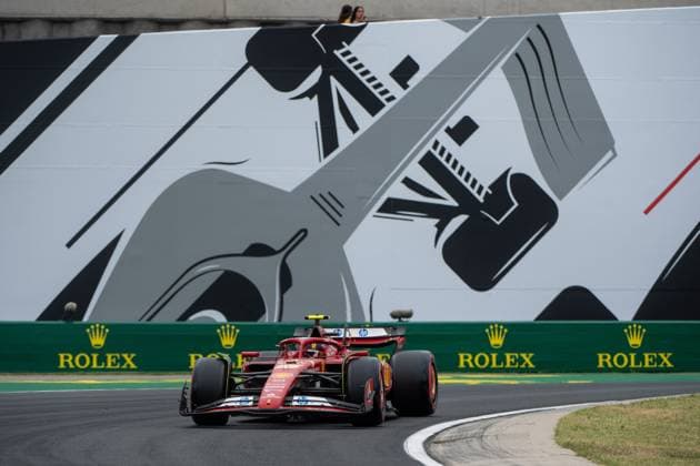Carlos Sainz Scuderia Ferrari HP, Spain, 55 in Ferrari SF 24 in front of a painting of a silver Formula 1 car and Rolex branding, HUN, Formula 1 World Championship, Hungarian Grand Prix, Hungaroring, Free Practice, 20 07 2024 HUN, Formula 1 World Championship, Hungarian Grand Prix, Hungaroring, Free Practice, 20 07 2024 Mogyorod Copyright: xEibner-Pressefoto Memmlerx EP_MMR