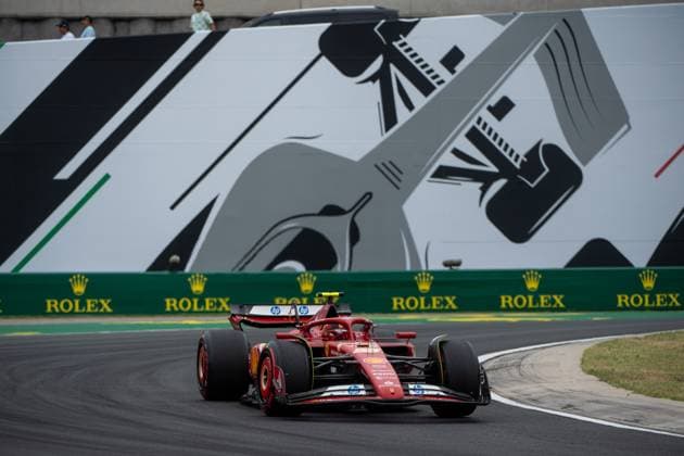 Carlos Sainz Scuderia Ferrari HP, Spain, 55 in Ferrari SF 24 in front of a painting of a silver Formula 1 car and Rolex branding, HUN, Formula 1 World Championship, Hungarian Grand Prix, Hungaroring, Free Practice, 20 07 2024 HUN, Formula 1 World Championship, Hungarian Grand Prix, Hungaroring, Free Practice, 20 07 2024 Mogyorod Copyright: xEibner-Pressefoto Memmlerx EP_MMR