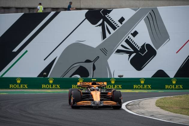Lando Norris McLaren Formula 1 Team, Great Britain, 04 in McLaren MCL38 in front of a painting of a silver Formula 1 car and Rolex branding, HUN, Formula 1 World Championship, Hungarian Grand Prix, Hungaroring, Free Practice, 20 07 2024 HUN, Formula 1 World Championship, Hungarian Grand Prix, Hungaroring, Free Practice, 20 07 2024 Mogyorod Copyright: xEibner-Pressefoto Memmlerx EP_MMR
