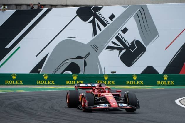 Carlos Sainz Scuderia Ferrari HP, Spain, 55 in Ferrari SF 24 in front of a painting of a silver Formula 1 car and Rolex branding, HUN, Formula 1 World Championship, Hungarian Grand Prix, Hungaroring, Free Practice, 20 07 2024 HUN, Formula 1 World Championship, Hungarian Grand Prix, Hungaroring, Free Practice, 20 07 2024 Mogyorod Copyright: xEibner-Pressefoto Memmlerx EP_MMR