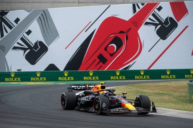 Sergio Checo Perez Oracle Red Bull Racing, Mexico, 11 in the RedBull RB20 in front of the painting of a red Formula 1 car and Rolex branding, HUN, Formula 1 World Championship, Hungarian Grand Prix, Hungaroring, Free Practice, 20 07 2024 HUN, Formula 1 World Championship, Hungarian Grand Prix, Hungaroring, Free Practice, 20 07 2024 Mogyorod Copyright: xEibner-Pressefoto Memmlerx EP_MMR