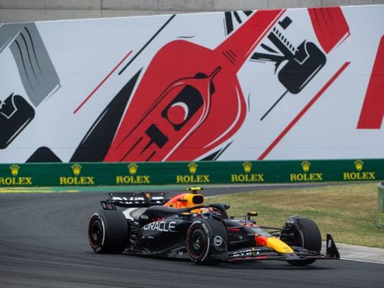 Sergio Checo Perez Oracle Red Bull Racing, Mexico, 11 in the RedBull RB20 in front of the painting of a red Formula 1 car and Rolex branding, HUN, Formula 1 World Championship, Hungarian Grand Prix, Hungaroring, Free Practice, 20 07 2024 HUN, Formula 1 World Championship, Hungarian Grand Prix, Hungaroring, Free Practice, 20 07 2024 Mogyorod Copyright: xEibner-Pressefoto Memmlerx EP_MMR