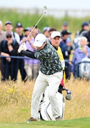 Robert MacIntyre plays a right handed shot with a reverse club head as his stance was impeded by a bunker. He sliced it up against the grandstand The British Open Championship, Day Three, Golf, Royal Troon, Troon, UK - 20 July 2024  Copyright: xGreigxCowie Shutterstockx 14587997x