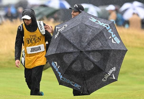 Matthew Jordan waves to the fans on the 18th fairway as he protects himself with his umbrella The British Open Championship, Day Three, Golf, Royal Troon, Troon, UK - 20 July 2024  Copyright: xGreigxCowie Shutterstockx 14587997dl