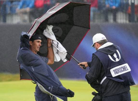 Billy Horschel puts on his rain jacket at the 17th green. The British Open Championship, Day Three, Golf, Royal Troon, Troon, UK - 20 July 2024  Copyright: xStuartxWallace Shutterstockx 14588004bw