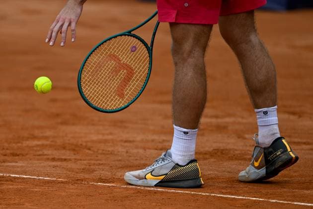 TENNIS - ATP, Tennis Herren Generali Open 2024 KITZBUEHEL,AUSTRIA,22.JUL.24 - TENNIS - ATP World Tour, Generali Open. Image shows a feature with a racket and a ball.  GEPAxpictures xDanielxSchoenherr