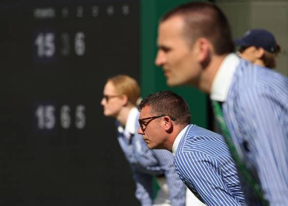Wimbledon Feature , Three linesmen looking at the line, profile, from the side, portrait, portrait, scoreboard in the background Copyright: xJuergenxHasenkopfx