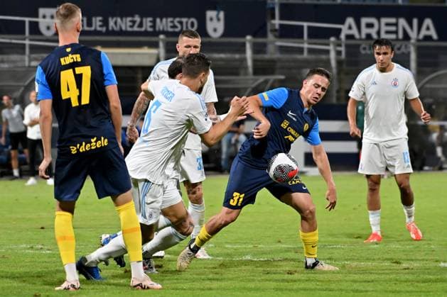 Celje, Slovenia, 24th 2024: Jost Pisek of Celje (2R) in action against Kevin Wimmer of Slovan Bratislava (2L) during the UEFA Champions League 2nd qualifying round football match between Celje (Slovenia) and Slovan Bratislava (Slovakia) at Stadium Celje, Celje, Slovenia. (Igor Kupljenik SPP) Copyright: xIgorxKupljenikx xSPPx spp-en-IgKuSp-IK0_1443