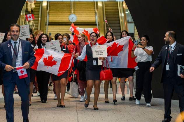 July 24, 2024, Toronto, On, Canada: Members of Air Canada and the 2024 Canadian Olympic Team celebrate as they arrive at Pearson Airport prior to boarding a flight to Paris for the 2024 Paris Olympics, in Toronto on Wednesday, July 24, 2024. Canada News - July 24, 2024  - ZUMAc35_ 20240724_zaf_c35_128 Copyright: xChristopherxKatsarovx