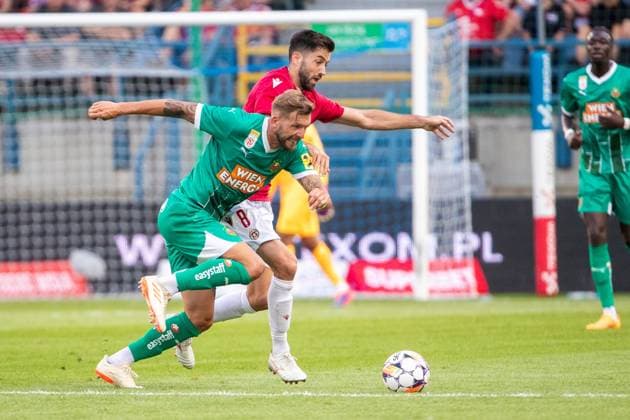 SOCCER - UEFA EL, Krakow vs Rapid KRAKOW,POLAND,25.JUL.24 - SOCCER - UEFA Europa League, qualification, Wisla Krakow vs SK Rapid Wien. Image shows Guido Burgstaller (Rapid) and Marc Carbo (Krakow).  GEPAxpictures xPhilippxBrem