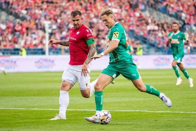 SOCCER - UEFA EL, Krakow vs Rapid KRAKOW,POLAND,25.JUL.24 - SOCCER - UEFA Europa League, qualification, Wisla Krakow vs SK Rapid Wien. Image shows Alan Uryga (Krakow) and Noah Bischof (Rapid).  GEPAxpictures xPhilippxBrem