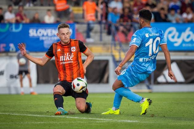 RUZOMBEROK - TRABZONSPOR UEFA EUROPA LEAGUE Matus Maly of Ruzomberok and Trezeguet of Trabzonspor during the 1st leg of Second qualifying round of the UEFA Europa League football match between MFK Ruzomberok and Trabzonspor. Ruzomberok, Slovakia, July 25, 2024. PUBLICATION NOT IN SLOVAKIA Ruzomberok Copyright: xBranislavxRackox 080A4902