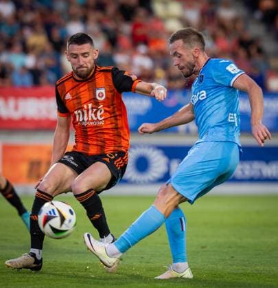 RUZOMBEROK - TRABZONSPOR UEFA EUROPA LEAGUE Timotej Mudry of Ruzomberok and Edin Visca of Trabzonspor during the 1st leg of Second qualifying round of the UEFA Europa League football match between MFK Ruzomberok and Trabzonspor. Ruzomberok, Slovakia, July 25, 2024. PUBLICATION NOT IN SLOVAKIA Ruzomberok Copyright: xBranislavxRackox 080A4944