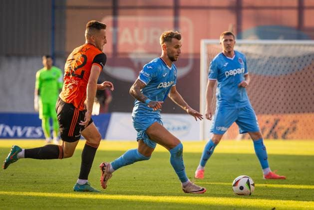 RUZOMBEROK - TRABZONSPOR UEFA EUROPA LEAGUE Matus Maly of Ruzomberok and Denis Dragus of Trabzonspor during the 1st leg of Second qualifying round of the UEFA Europa League football match between MFK Ruzomberok and Trabzonspor. Ruzomberok, Slovakia, July 25, 2024. PUBLICATION NOT IN SLOVAKIA Ruzomberok Copyright: xBranislavxRackox 080A4373