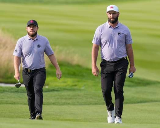 26th July 2024; JCB Golf &amp; Country Club, Rocester, Uttoxeter, England; LIV UK Golf League, Round 1; Jon Rahm and Tyrrell Hatton of the Legion XIII GC walks onto the 9th green  ActionPlus12672204 StevenxFlynn