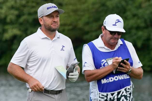 26th July 2024; JCB Golf &amp; Country Club, Rocester, Uttoxeter, England; LIV UK Golf League, Round 1; Graeme McDowell of the Smash GC checks the yardage with his caddy on the first hole  ActionPlus12672390 StevenxFlynn