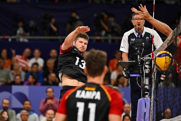 Olympic Games Volleyball GER vs JPN Paris 27 07 2024 Paris 2024, Olympics, Volleyball, South Paris Arena, Men, Germany in black vs Japan in red Ruben Schott in attack, ball in the net Copyright: xBEAUTIFULxSPORTS TomxBlochx