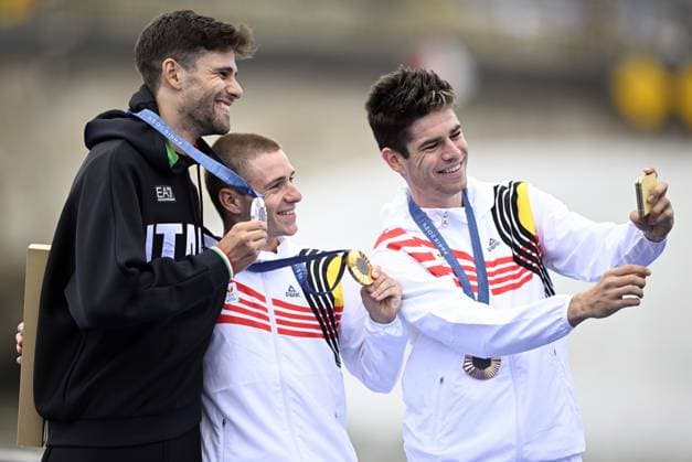Italian silver medallist Filippo Ganna, Belgian gold medallist Remco Evenepoel and Belgian bronze medallist Wout van Aert take a selfie picture during the podium ceremony of the men s time trial event at the Paris 2024 Olympic Games, Olympische Spiele, Olympia, OS on Saturday 27 July 2024 in Paris, France . The Games of the XXXIII Olympiad are taking place in Paris from 26 July to 11 August. The Belgian delegation counts 165 athletes in 21 sports. JASPERxJACOBS  x97170117x