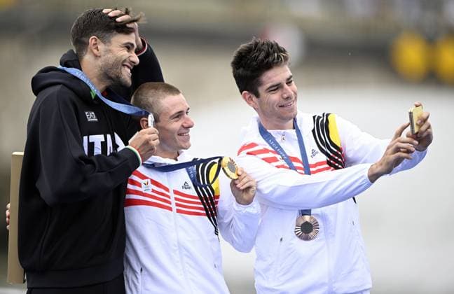 Italian silver medallist Filippo Ganna, Belgian gold medallist Remco Evenepoel and Belgian bronze medallist Wout van Aert take a selfie picture during the podium ceremony of the men s time trial event at the Paris 2024 Olympic Games, Olympische Spiele, Olympia, OS on Saturday 27 July 2024 in Paris, France . The Games of the XXXIII Olympiad are taking place in Paris from 26 July to 11 August. The Belgian delegation counts 165 athletes in 21 sports. JASPERxJACOBS  x97171727x