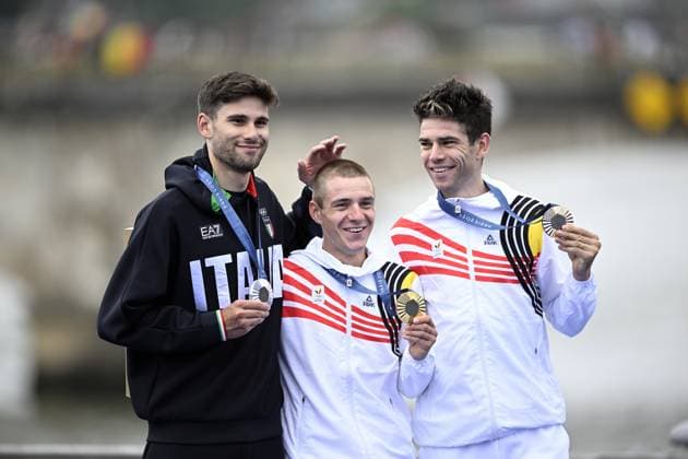 Italian silver medallist Filippo Ganna, Belgian gold medallist Remco Evenepoel and Belgian bronze medallist Wout van Aert pictured during the podium ceremony of the men s time trial event at the Paris 2024 Olympic Games, Olympische Spiele, Olympia, OS on Saturday 27 July 2024 in Paris, France . The Games of the XXXIII Olympiad are taking place in Paris from 26 July to 11 August. The Belgian delegation counts 165 athletes in 21 sports. JASPERxJACOBS  x97171742x