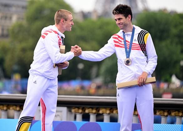 Belgian gold medallist Remco Evenepoel and Belgian bronze medallist Wout van Aert shake hands during the podium ceremony of the men s time trial event at the Paris 2024 Olympic Games, Olympische Spiele, Olympia, OS on Saturday 27 July 2024 in Paris, France . The Games of the XXXIII Olympiad are taking place in Paris from 26 July to 11 August. The Belgian delegation counts 165 athletes in 21 sports. LAURIExDIEFFEMBACQ  x97173317x