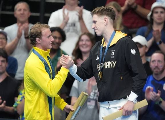 Gold medalist Lukas Maertens of Germany (R) is congratulated by silver medalist Elijah Winnington of Australia after the Men s 400m Freestyle Finals at the Paris 2024 Olympic Games, Olympische Spiele, Olympia, OS at La Defense Arena in Paris, France on Saturday, July 27, 2024. Maertens won the gold medal, Elijah Winnington of Australia won the silver and Woomin Kim of South Korea won the bronze.  OLY202407271580 RICHARDxELLIS