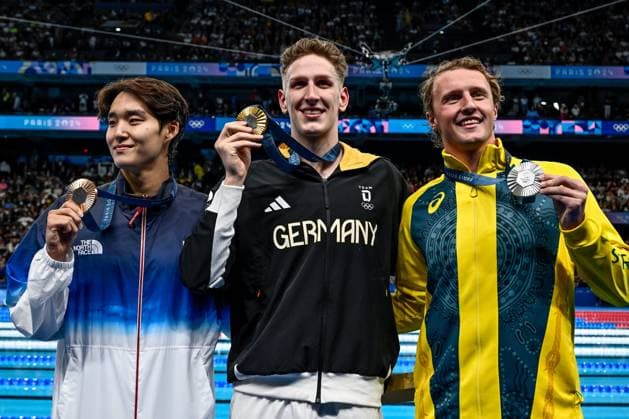 Woomin Kim of Korea, bronze, Lukas Martens of Germany, gold, Elijah Winnington of Australia, silver, show the medals after competing in the swimming 400m Freestyle Men Final during the Paris 2024 Olympic Games, Olympische Spiele, Olympia, OS at La Defense Arena in Paris (France), July 27, 2024. Giorgio Scala