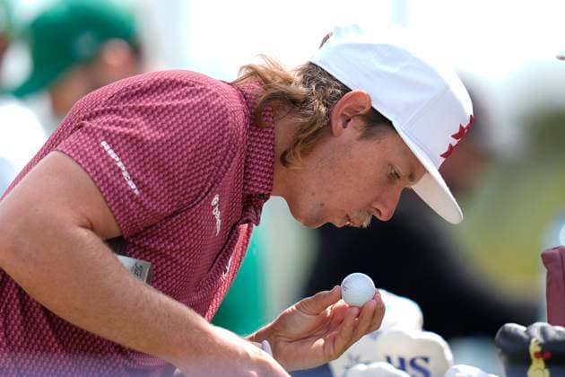 28th July 2024; JCB Golf &amp; Country Club, Rocester, Uttoxeter, England; LIV UK Golf League, Final Round; Cameron Smith of the Rippers GC dries the ink after marking his golf ball as he warms up on the practice ground before the final round  ActionPlus12673270 StevenxFlynn