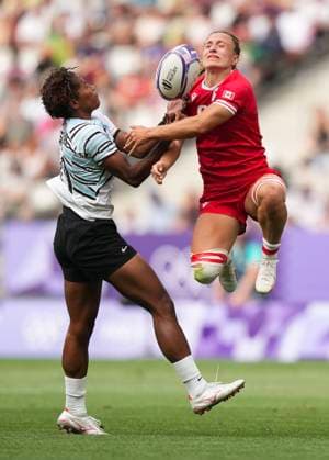 July 28, 2024, Paris, FRANCE: Canada forward Krissy Scurfield (9) battles for the loose ball against Fiji forward Laisana Likuceva (10) during second half Women rugby 7s rugby action at the Paris Summer Olympics in Paris, France on Sunday, July 28, 2024. Canada News - July 28, 2024  - ZUMAc35_ 20240728_zaf_c35_054 Copyright: xNathanxDenettex