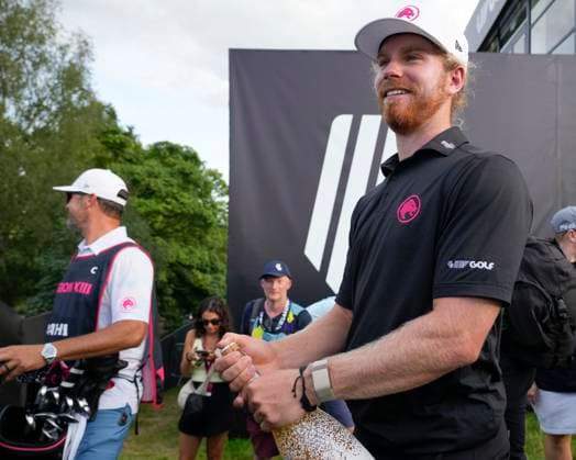 28th July 2024; JCB Golf &amp; Country Club, Rocester, Uttoxeter, England; LIV UK Golf League, Final Round; Kieran Vincent of the Legion XIII GC prepares the champagne as team mate Jon Rahm of the Legion XIII GC wins the event  ActionPlus12673817 StevenxFlynn