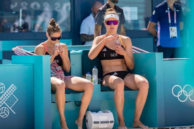 July 28, 2024, Paris, Ile de France, France: SVENJA MUELLER (GER) (1) and CINJA TILLMANN (GER) (2) prepare for their Preliminary Phase - Pool C Women s Beach volleyball, Beachvolleyball match against Team France (FRA) at the Stade Tour Eiffel stadium during the 2024 Paris Summer Olympics in Paris, France. Paris France - ZUMAa161 20240728_oly_a161_115 Copyright: xWalterxArcex