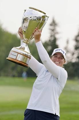 Golf: CPKC Women s Open Lauren Coughlin of the United States celebrates with the victor s trophy after winning the CPKC Women s Open golf tournament at Earl Grey Golf Club in Calgary, Canada, on July 28, 2024.  A14AA0003197736P