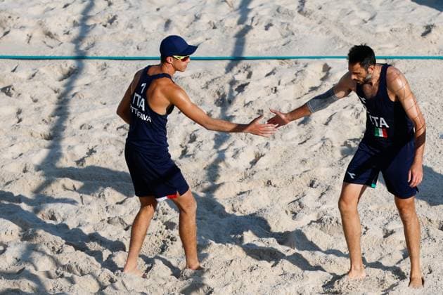 July 29, 2024, Paris, Paris, FRANCE: Samuele Cottafava of Italy and Paolo Nicolai of Italy compete against Izac Carracher of Australia and Mark Nicolaidis of Australia during Beach volleyball, Beachvolleyball Men s Preliminary Phase - Pool A match at Eiffel Tower Stadium - Centre Court during the Paris 2024 Olympics Games on July 29, 2024 in Paris, France. Paris FRANCE - ZUMAa181 20240729_zaa_a181_024 Copyright: xManuxReinox