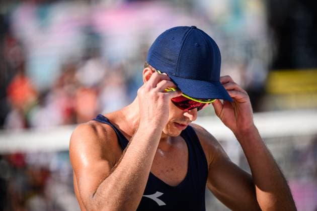 29 07 2024, Paris, Eiffel Tower Stadium Beach volleyball, Olympic Games, preliminary round Samuele Cottafava ITA straightens sunglasses