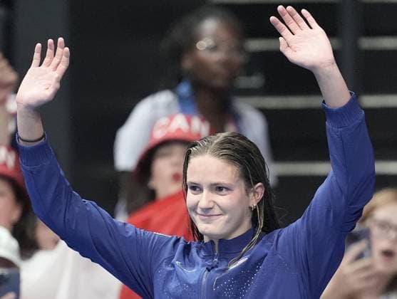 Silver medalist Katie Grimes of the U.S. reacts on the podium in the Women s 400m Individual Medley Final at the Paris 2024 Olympics at the Arena Le Defense in Paris, France on Monday, July 29, 2024. Summer McIntosh of Canada won the gold, Katie Grimes of the U.S. won silver and Emma Weyant of the U.S. won the bronze.  OLY202407291592 RICHARDxELLIS