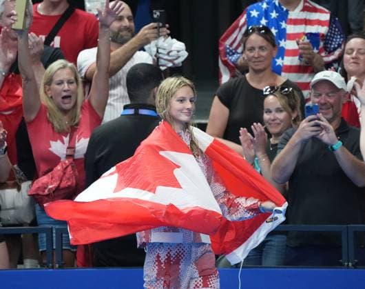 Gold medalist Summer McIntosh of Canada celebrates after the Women s 400m Individual Medley Final at the Paris 2024 Olympics at the Arena Le Defense in Paris, France on Monday, July 29, 2024. Katie Grimes of the U.S. won silver and Emma Weyant of the U.S. won the bronze.  OLY202407291593 RICHARDxELLIS