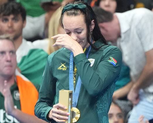Gold medalist Tatjana Smith of South Africa stands on the podium after winning the Women s 100m Breaststroke Finals at the Paris 2024 Olympics at the Arena Le Defense in Paris, France on Monday, July 29, 2024.  OLY202407291637 RICHARDxELLIS