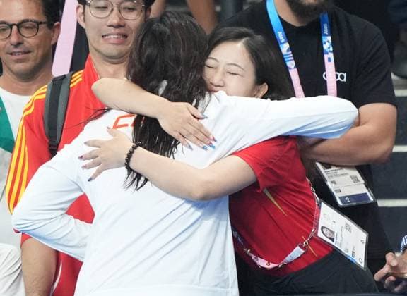 Silver medalist Qianting Tang of People s Republic of China is congratulated after the Women s 100m Breaststroke Finals at the Paris 2024 Olympics at the Arena Le Defense in Paris, France on Monday, July 29, 2024.  OLY202407291639 RICHARDxELLIS