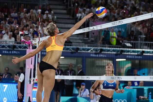PARIS, FRANCE - JULY 29: Louisa Lippmann of Germany spikes the ball at the Womens Beach volleyball, Beachvolleyball Preliminary rounds during the Paris 2024 Olympic Games, Olympische Spiele, Olympia, OS match between Lezana Placate and Alexia Richard of France, Laura Ludwig and Louisa Lippmann of Germany at the Eiffel Tower Stadium on July 29, 2024 in Paris, France. (Photo by Pete Dovgan Speed Media Icon Sportswire) OLYMPICS: JUL 29 Paris 2024 EDITORIAL USE ONLY Icon2407290541