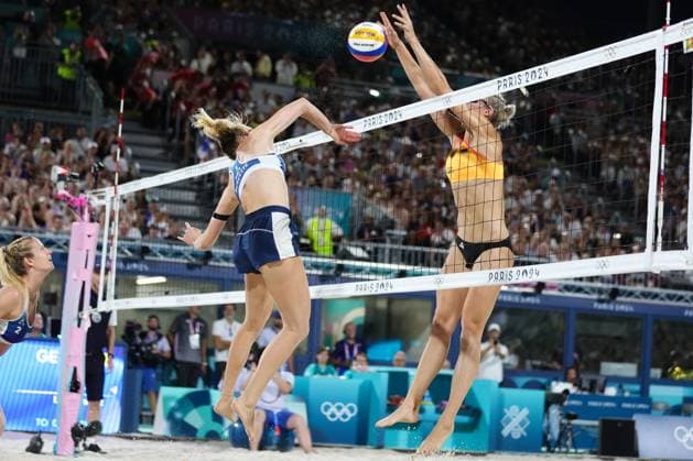 PARIS, FRANCE - JULY 29: Louisa Lippmann of Germany spikes at the Womens Beach volleyball, Beachvolleyball Preliminary rounds during the Paris 2024 Olympic Games, Olympische Spiele, Olympia, OS match between Lezana Placate and Alexia Richard of France, Laura Ludwig and Louisa Lippmann of Germany at the Eiffel Tower Stadium on July 29, 2024 in Paris, France. (Photo by Pete Dovgan Speed Media Icon Sportswire) OLYMPICS: JUL 29 Paris 2024 EDITORIAL USE ONLY Icon2407290568