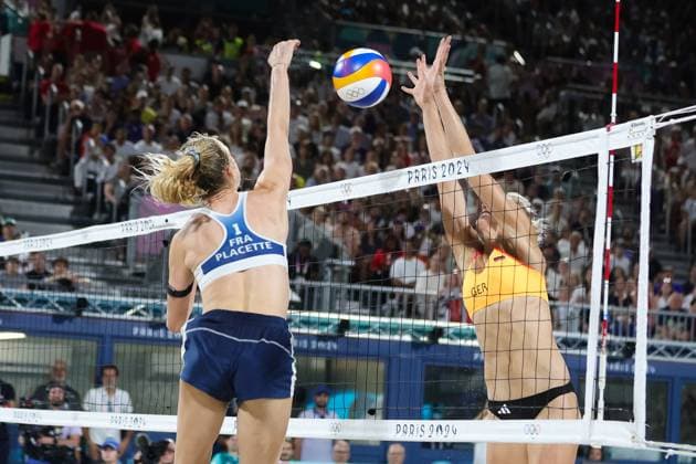 PARIS, FRANCE - JULY 29: Lezana Placate of France spikes the ball at the Womens Beach volleyball, Beachvolleyball Preliminary rounds during the Paris 2024 Olympic Games, Olympische Spiele, Olympia, OS match between Lezana Placate and Alexia Richard of France, Laura Ludwig and Louisa Lippmann of Germany at the Eiffel Tower Stadium on July 29, 2024 in Paris, France. (Photo by Pete Dovgan Speed Media Icon Sportswire) OLYMPICS: JUL 29 Paris 2024 EDITORIAL USE ONLY Icon2407290577