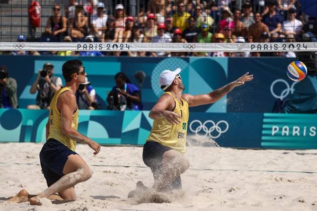 FRANCE, PARIS - JULY 30, 2024: Andre Loyola Stein (L) and George Suoto Maior Wanderley of Brazil compete in a men s Pool D - Preliminary Phase Beach volleyball, Beachvolleyball match between Brazil and Cuba at the 2024 Summer Olympic Games, Olympische Spiele, Olympia, OS by the Eiffel Tower on the Champ de Mars. Alexander Shcherbak TASS  72537105