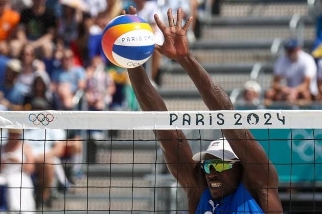 FRANCE, PARIS - JULY 30, 2024: Jorge Luis Alayo Moliner of Cuba competes in a men s Pool D - Preliminary Phase Beach volleyball, Beachvolleyball match between Brazil and Cuba at the 2024 Summer Olympic Games, Olympische Spiele, Olympia, OS by the Eiffel Tower on the Champ de Mars. Alexander Shcherbak TASS  72538187