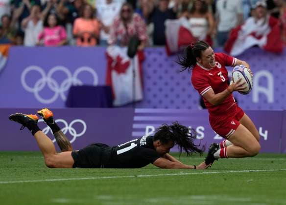 July 30, 2024, Paris, France: Canada forward Alysha Corrigan (3) eludes New Zealand back Portia Woodman-Wickliffe (11) during the women s rugby sevens gold medal match at the Summer Olympics in Paris on Tuesday, July 30, 2024. Canada News - July 30, 2024  - ZUMAc35_ 20240730_zaf_c35_058 Copyright: xAdrianxWyldx