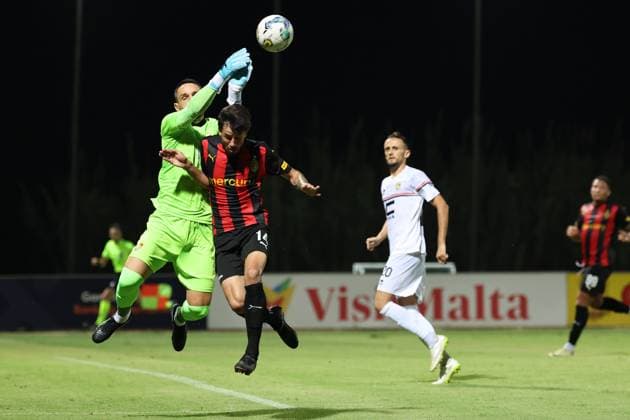 PAOLA, MALTA - JULY 30: Enea Kolici (L) goalkeeper of Ballkani is competing for the ball with Elionay (C) of Hamrun Spartans during the UEFA Europa Conference League, Second Qualifying Round, 2nd Leg soccer match between Hamrun Spartans and Ballkani at the Tony Bezzina Stadium, Paola, Malta on 30 July 2024. Hamrun Spartans v Ballkani - UEFA Europa Conference League 2024 2025, Second Qualifying Round, 2nd Leg
